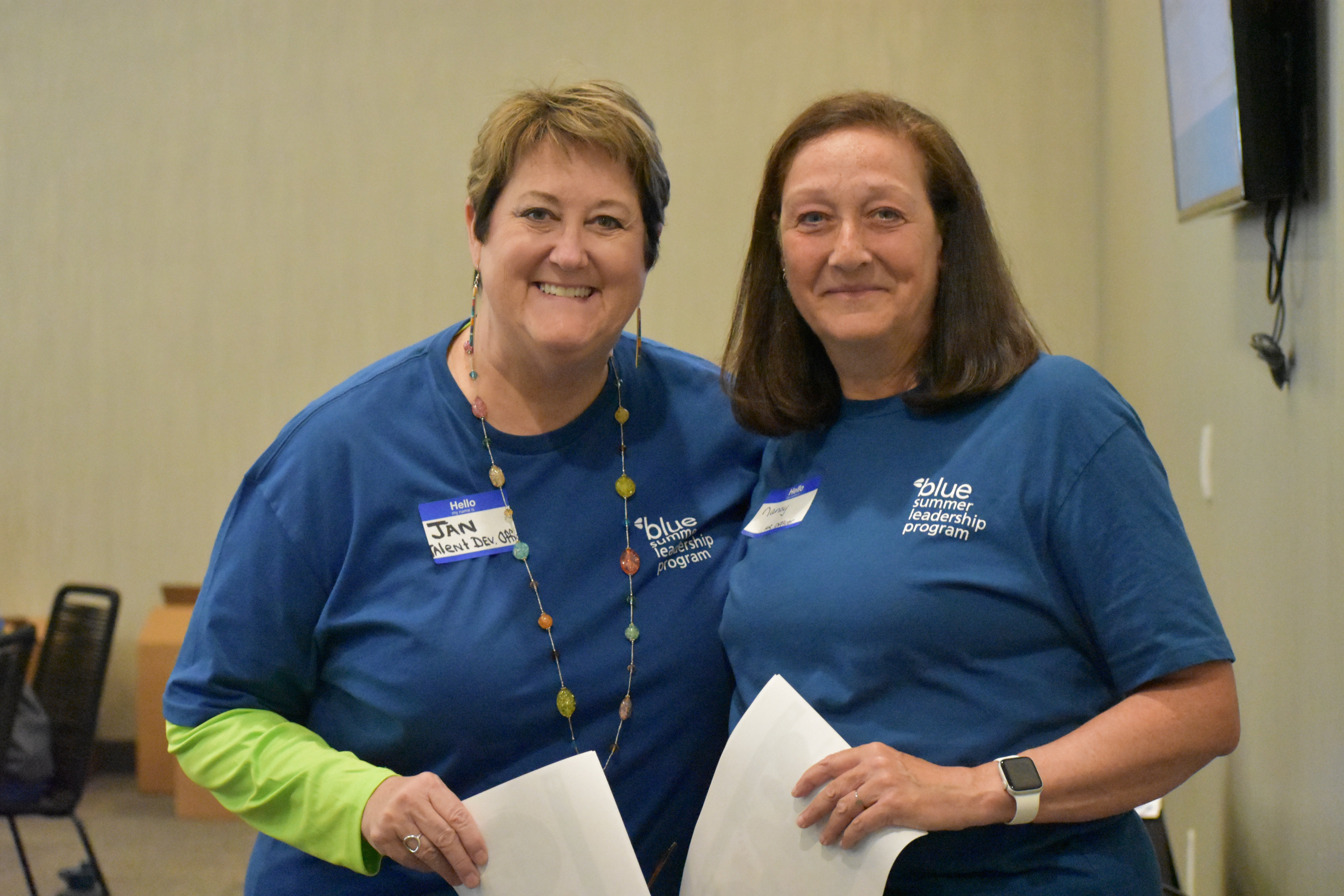 Jan Green and Nancy Rife smile before their presentation on DiSC Assessments at Blue's Summer Leadership Program 2023