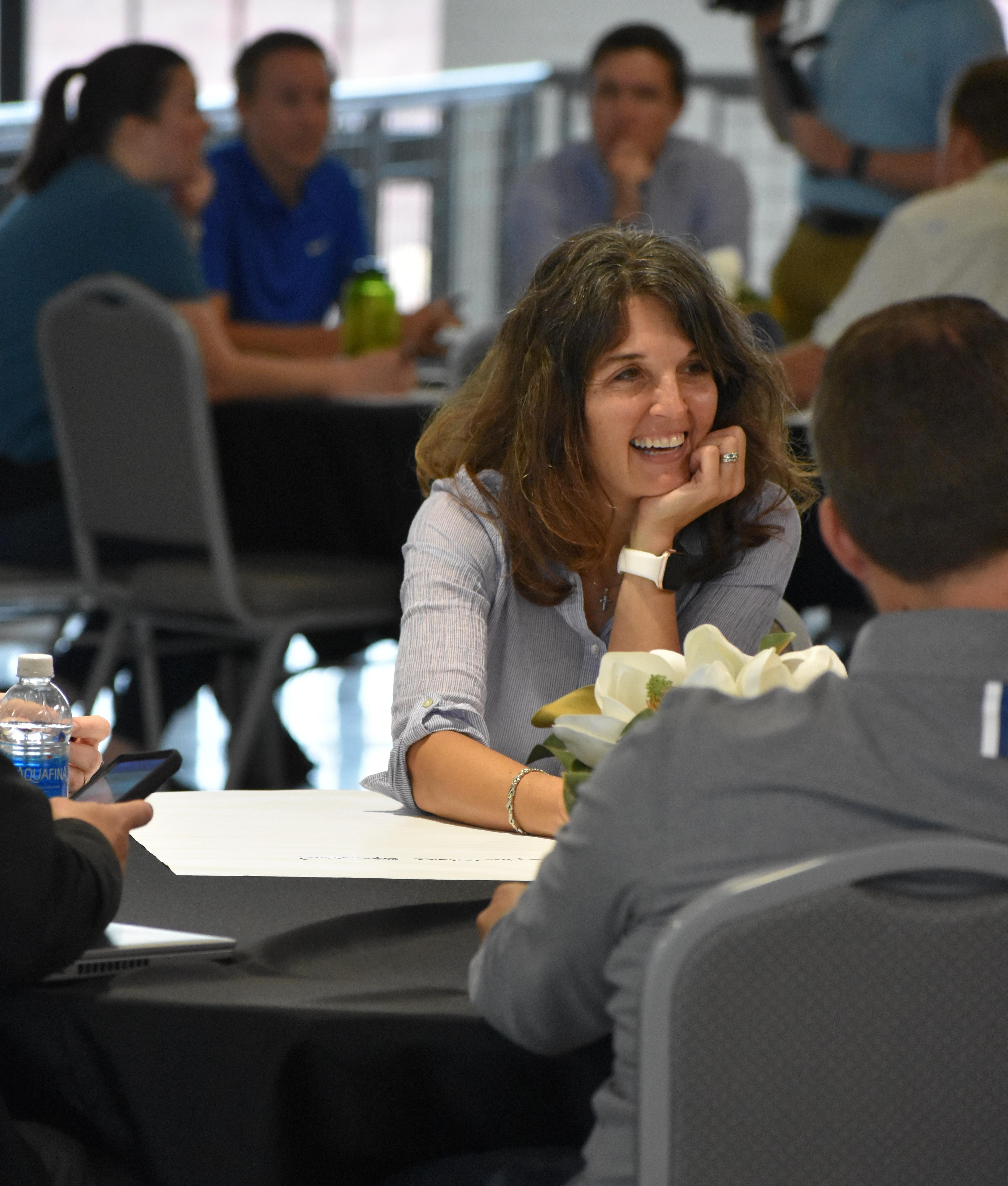 Debbie Herbert smiles as her team as they brainstorm | Talent Development Hosts Building Leaders Alumni Event in Cincinnati