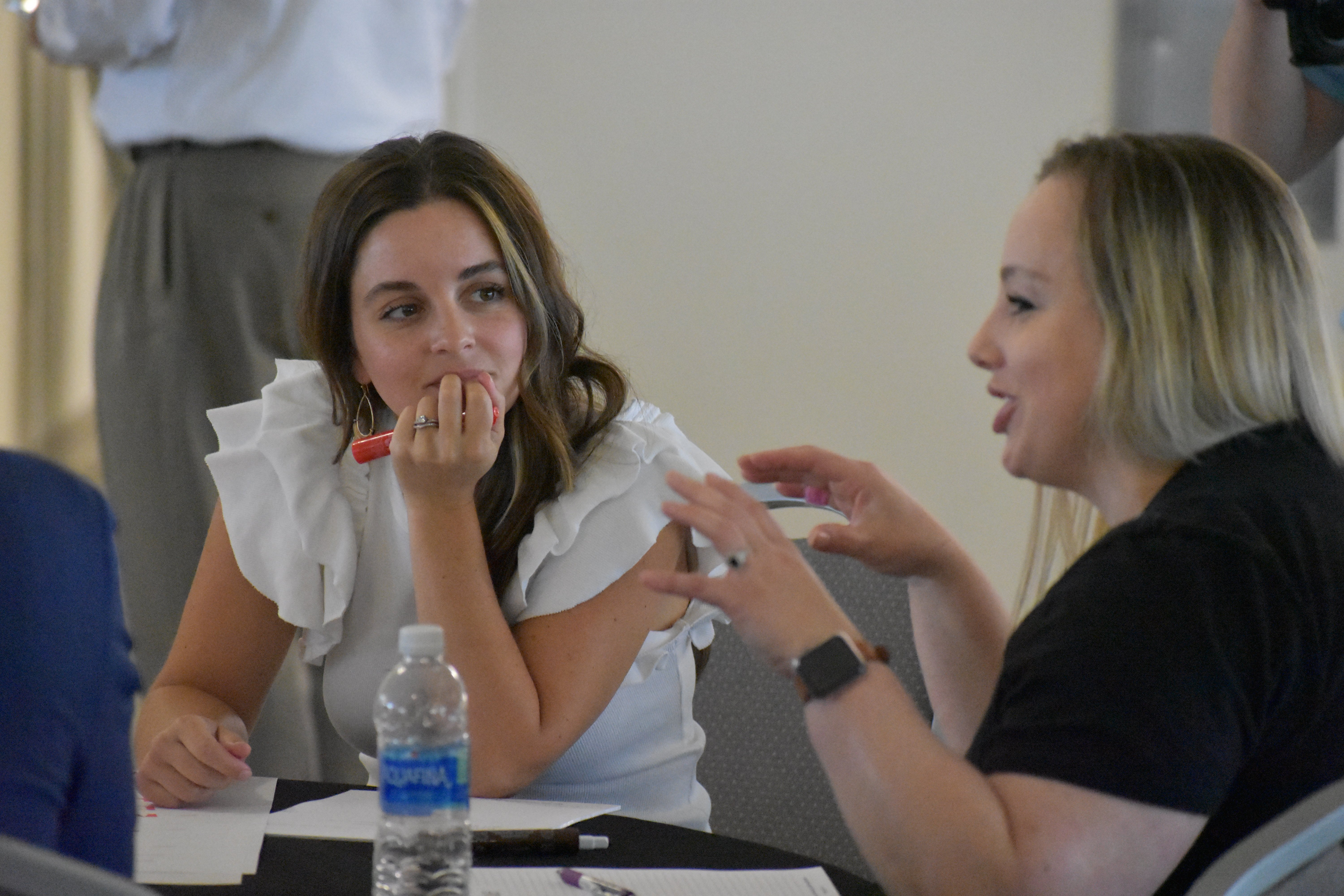 Rebecca Meredith smiles as she listens to Jessica Hildalgo | Talent Development Hosts Building Leaders Alumni Event in Cincinnati