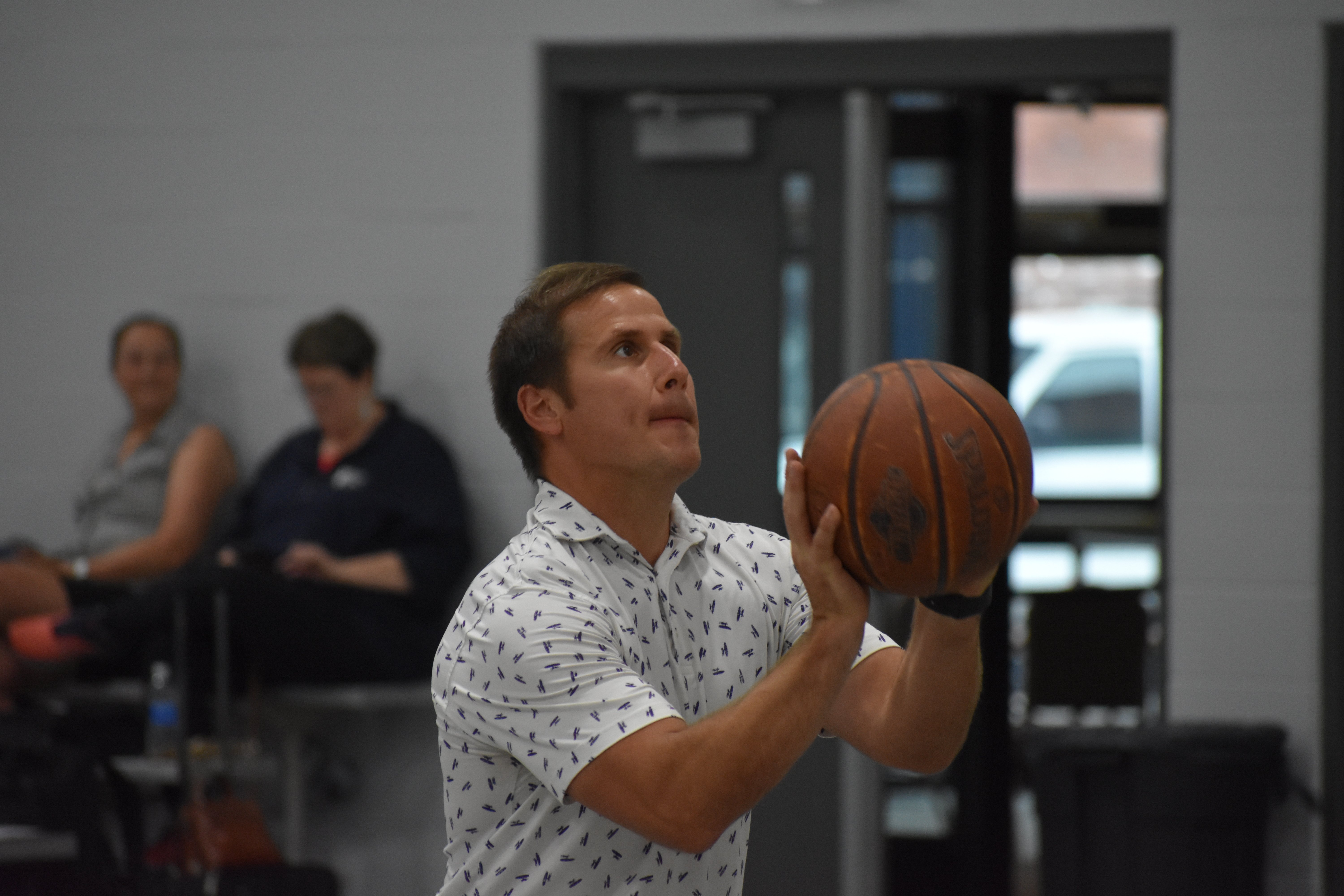Peter Szostak lines up his basketball shot | Talent Development Hosts Building Leaders Alumni Event in Cincinnati
