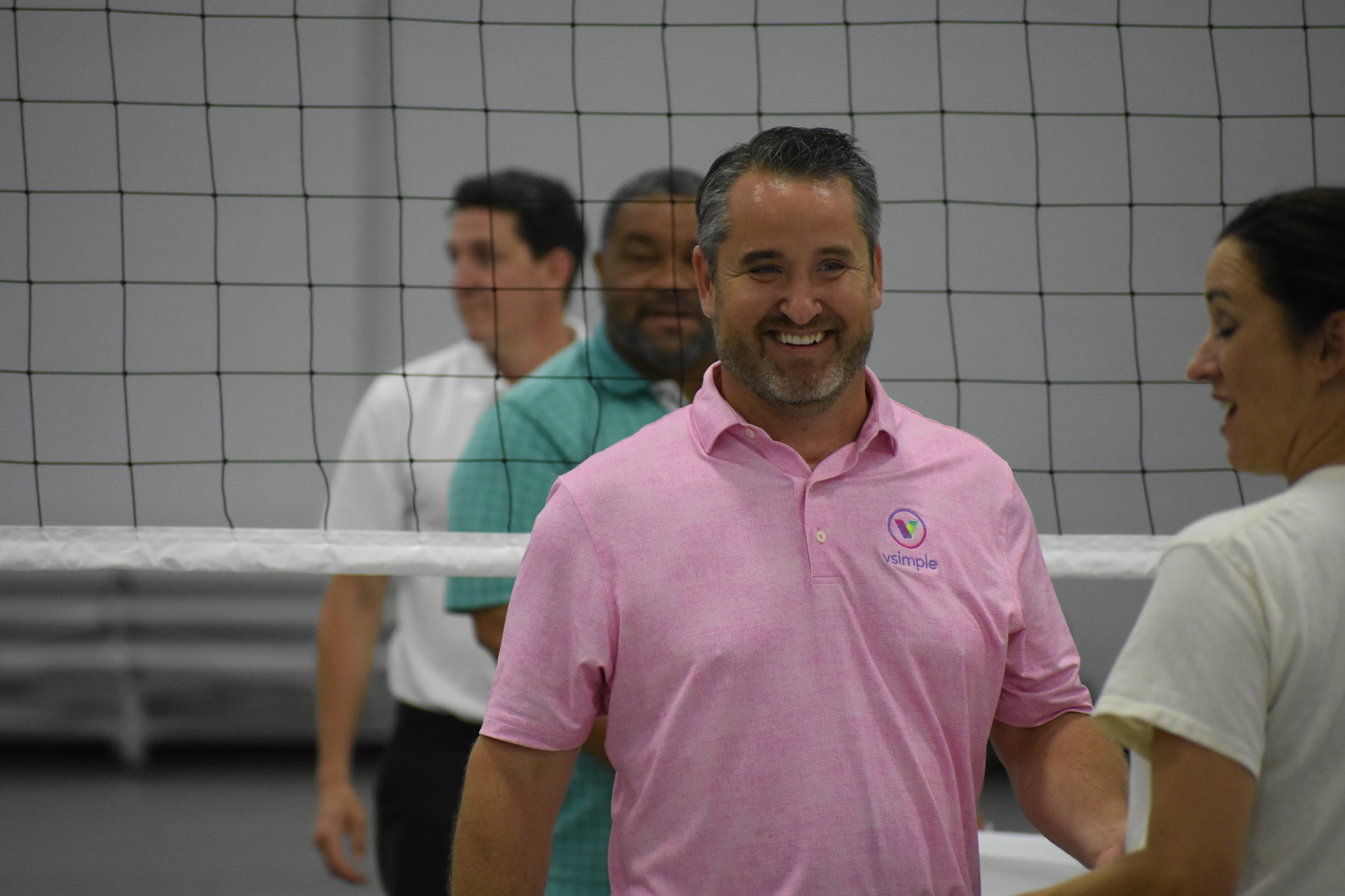 Kurt Beier smiles while playing Sheet Volleyball | Talent Development Hosts Building Leaders Alumni Event in Cincinnati