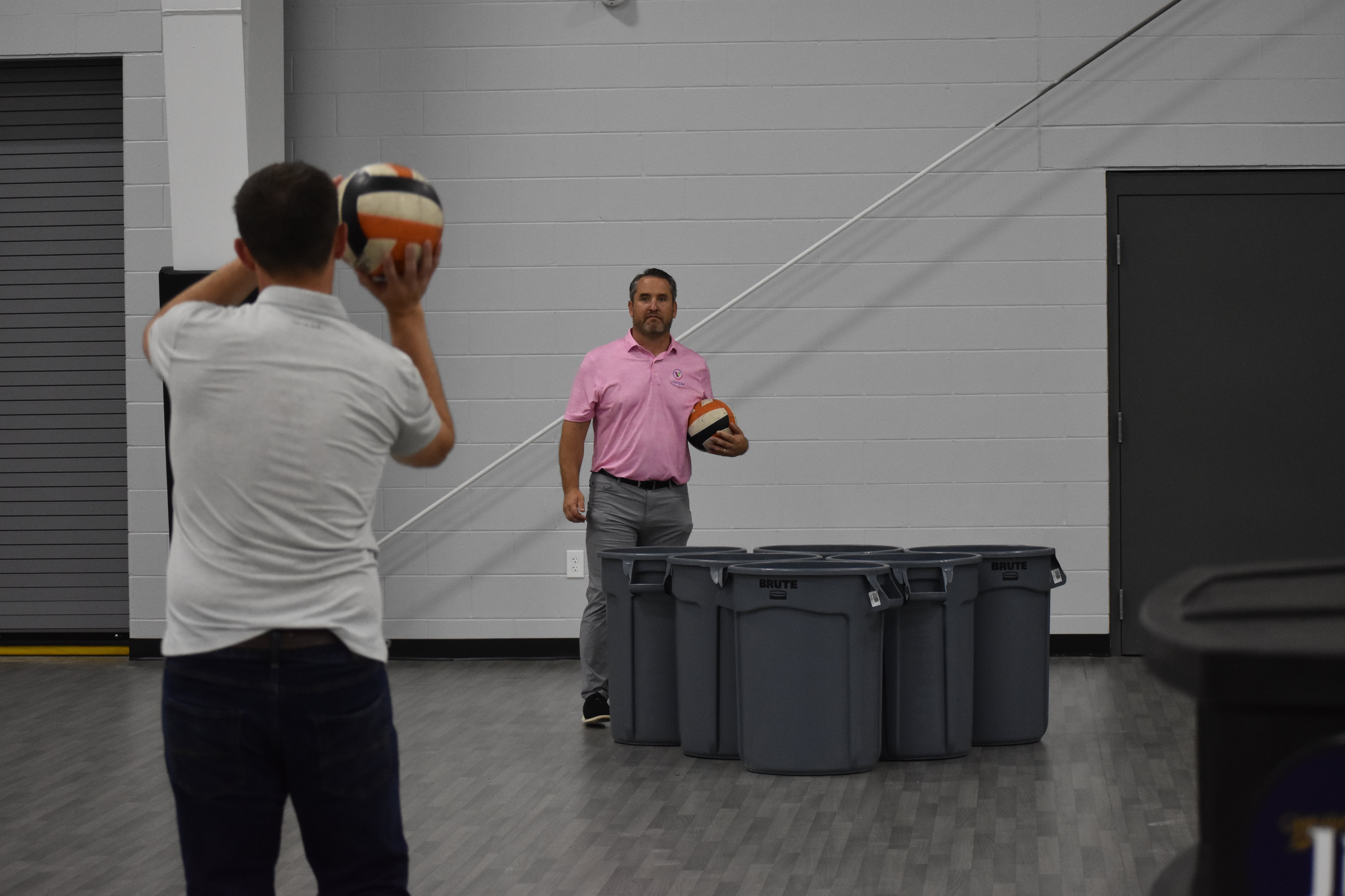 Alumni playing Trash Can Pong | Talent Development Hosts Building Leaders Alumni Event in Cincinnati
