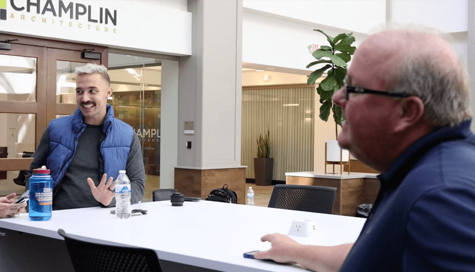 two men having conversation in coworking space - video thumbnail